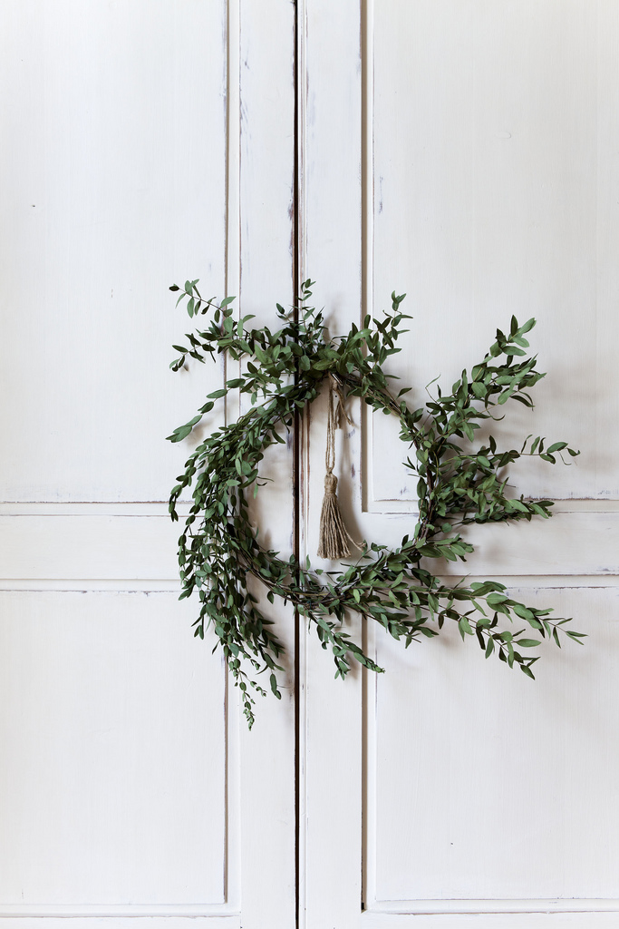 olive-wreath-on-white-washed-cabinet